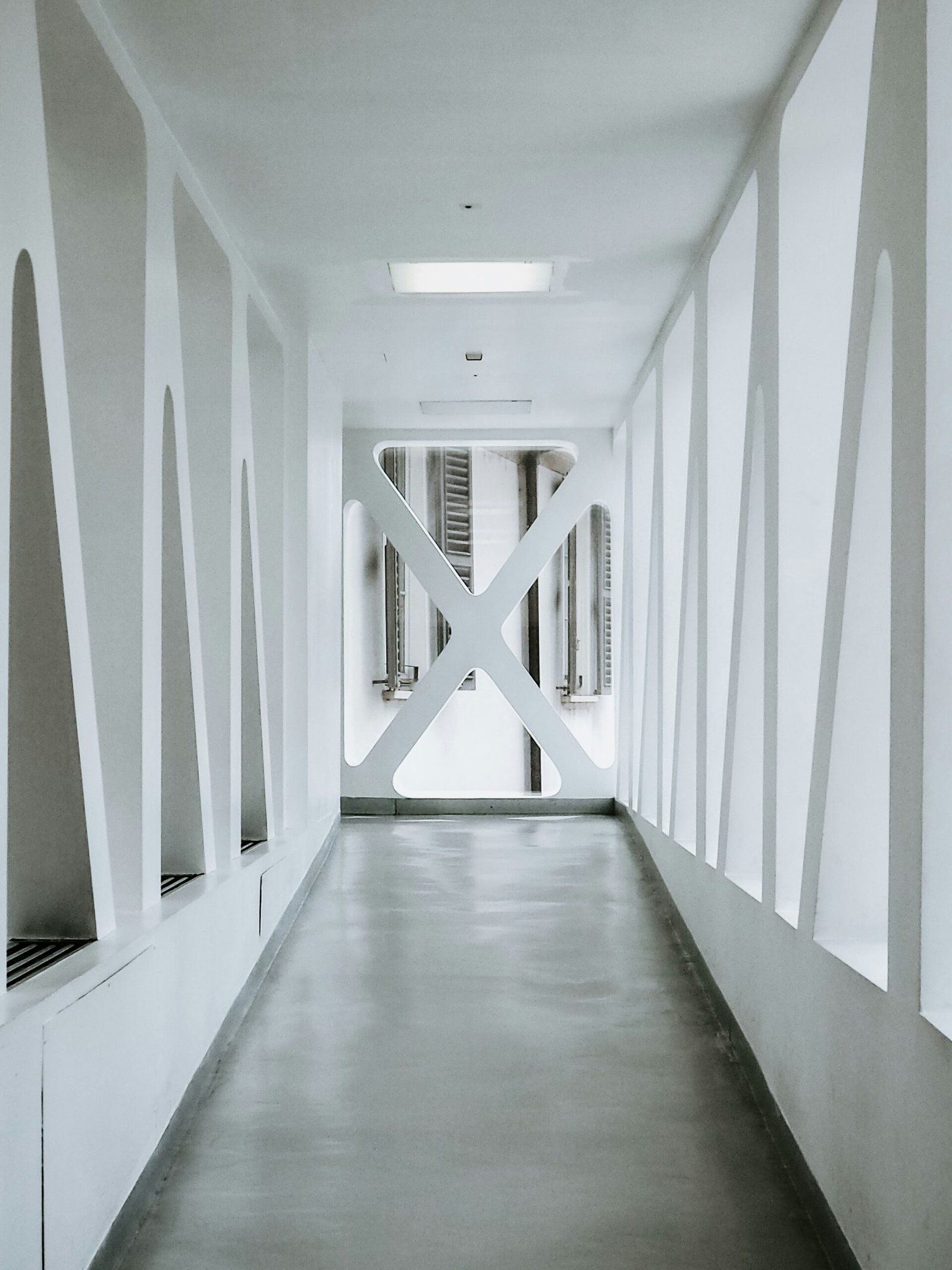 white painted building hallway